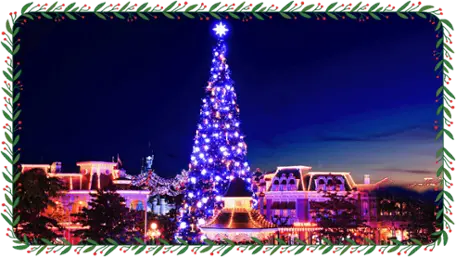Espectáculo de encendido del árbol de Navidad en Disneyland París, con luces y música iluminando el árbol en la plaza frente al castillo de la Bella Durmiente.